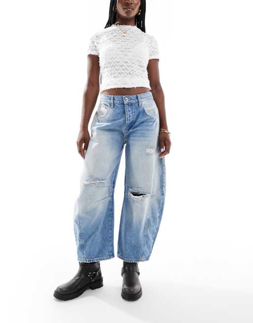 Free People - Jeans met rechte, wijde pijpen en gat in de knie in blauw wassing