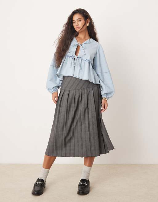 Free People – Ljusblå, tvättad blus i denim med knytning framtill