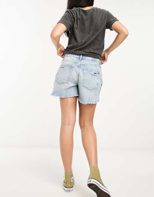 Free People Maggie mid rise denim shorts with rip details in blue