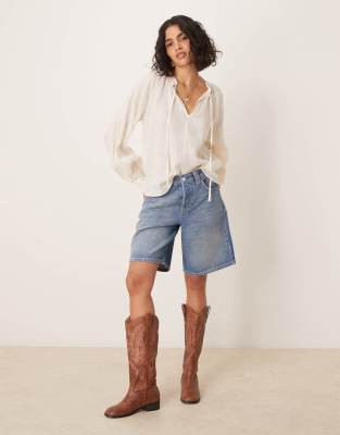 FREE PEOPLE MONTANA DISTRESSED DENIM JORTS 