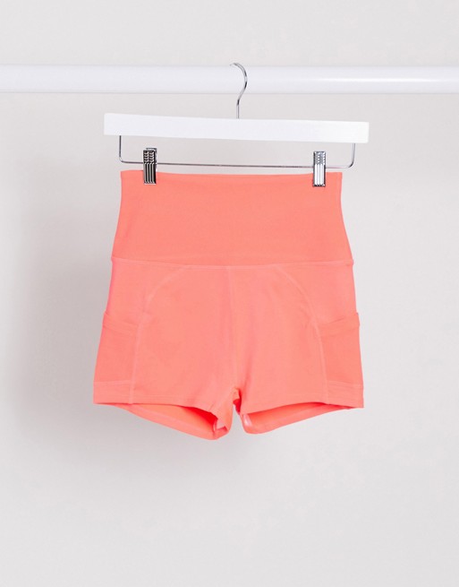Free People Movement off beat shorts in coral
