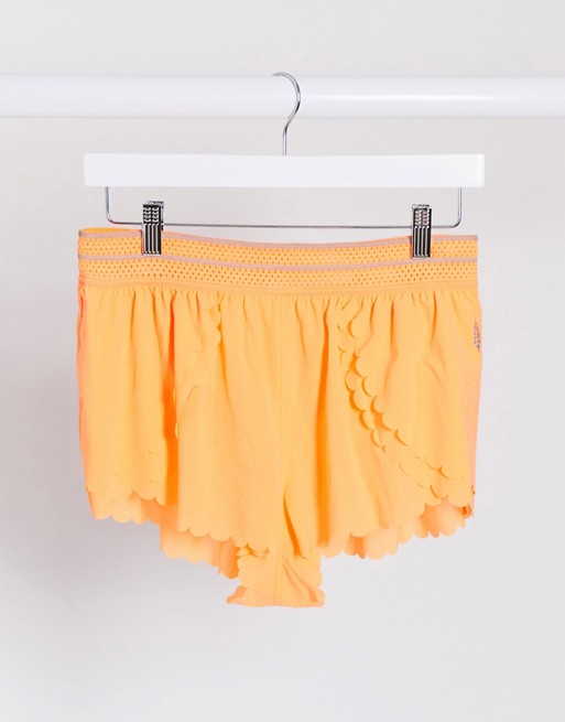 Free People Movement pretty lil running shorts in mango