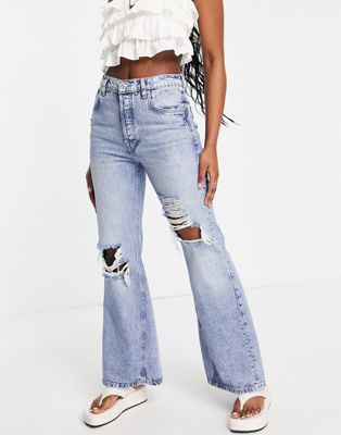 Free People new dawn rip detail flare in victoria blue - ASOS Price Checker