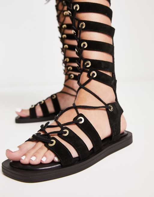 Free People Sun Chaser tall gladiator sandals in black ASOS