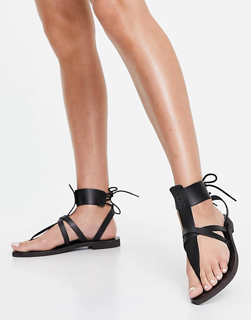 Free People vacation day wrap gladiator sandals in black