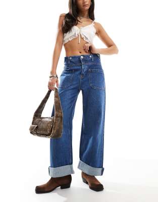 Free People - Weite Jeans in Blau mit mittelhohem Bund und Vordertaschen