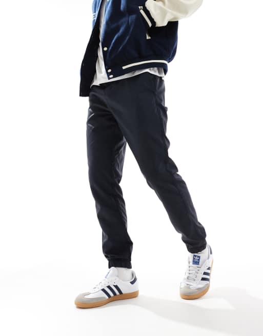 French Connection - Pantaloni multitasche tecnici blu navy con fondo elasticizzato