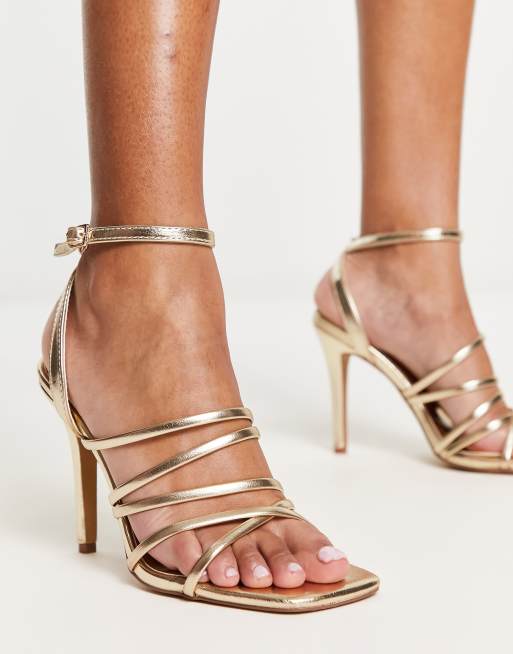 Stiletto hot sale gold heels