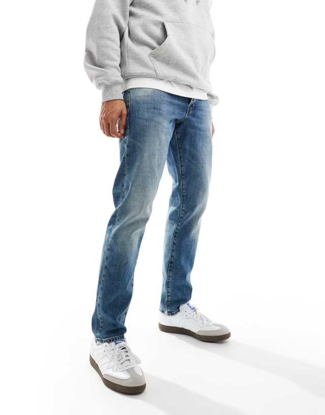 G-Star - 3301 regular tapered denim jeans in midwash blue