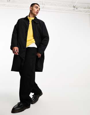 Gabardina negra acolchada con botones de Fred Perry | ASOS