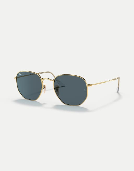 Gafas de sol doradas con montura hexagonal irregular y lentes azules planas de Ray-Ban, 2 de 3