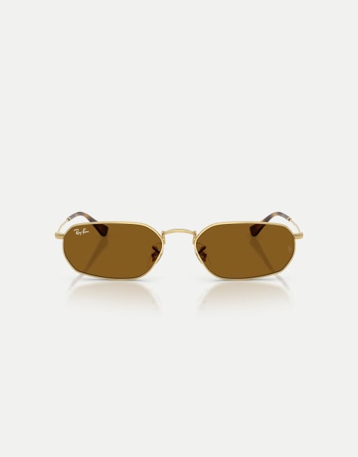 Gafas de sol doradas con montura irregular y lentes marrones de Ray-Ban