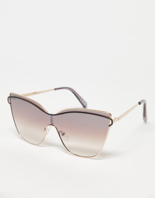 Gafas de sol doradas de estilo visor y ojos de gato con detalle de barra en la parte superior de SVNX