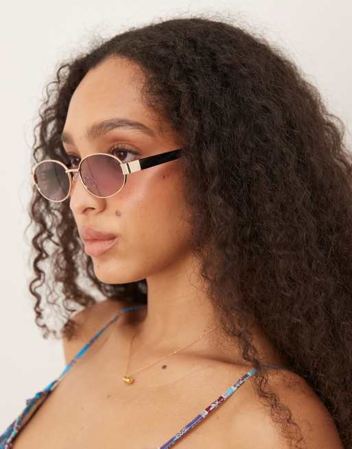 Gafas de sol doradas ovaladas con patillas negras de metal de ASOS DESIGN
