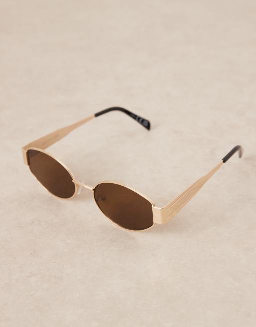 Gafas de sol doradas ovaladas de metal con lentes marrones de Gina Tricot, 2 de 3