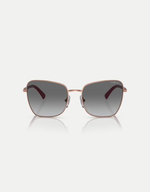 Gafas de sol dorado rosa con montura estilo mariposa y lentes grises de Vogue Eyewear