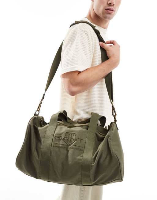 GANT – Beuteltasche in Khaki mit farblich abgestimmtem Wappenlogo