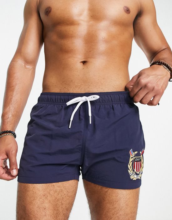 https://images.asos-media.com/products/gant-crest-embroidery-swim-shorts-in-navy/202458178-1-navy?$n_550w$&wid=550&fit=constrain