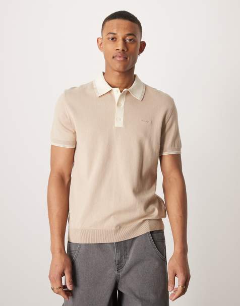 GANT – Kurzärmliges Strick-Polohemd in Beige mit Logo und Zierstreifen - view 1