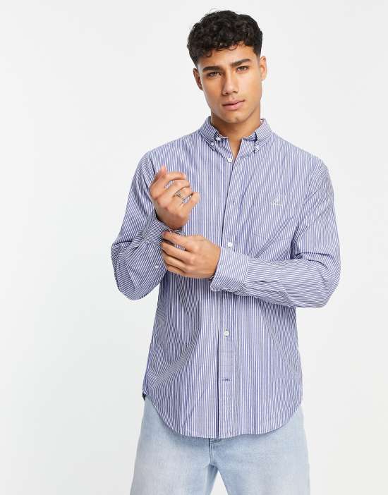 https://images.asos-media.com/products/gant-logo-pocket-regular-fit-stripe-poplin-button-down-shirt-in-blue/202832612-1-blue?$n_550w$&wid=550&fit=constrain