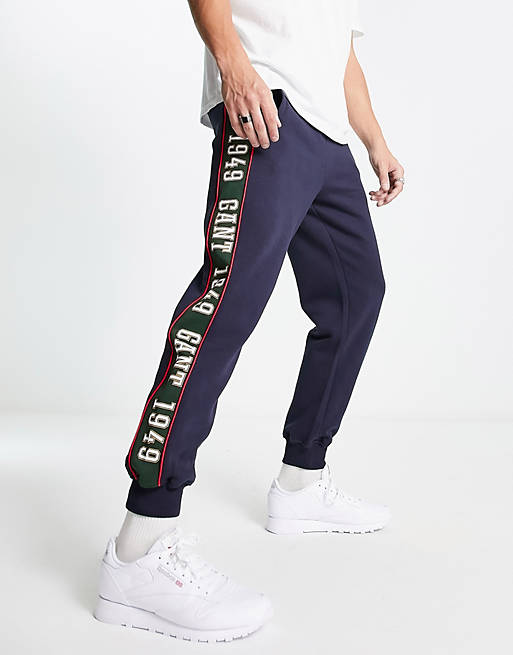 GANT side logo taping cuffed sweat joggers in navy | ASOS