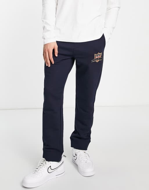 GANT trackies in navy with shield logo