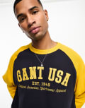 [Gant] GANT USA logo oversized fit baseball raglan sweatshirt in navy/yellow Chest 40-41 Navy/yellow