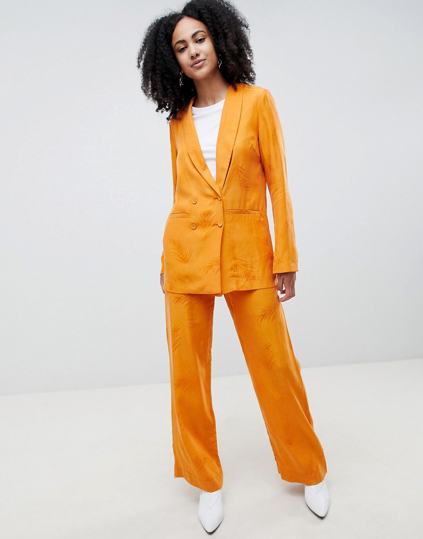 Gestuz - Orange bukser med vide ben og fjer-mønster