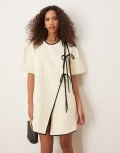 [Ghospell] Ghospell asymmetric contrast bow mini dress in pearl ivory-White XS Pearl Ivory