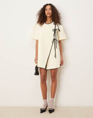 Ghospell asymmetric contrast bow mini dress in pearl ivory