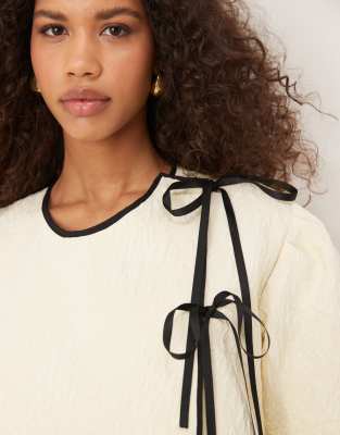 Ghospell asymmetric contrast bow mini dress in pearl ivory