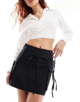 Ghospell Ghospell bow detail cargo mini skirt in black