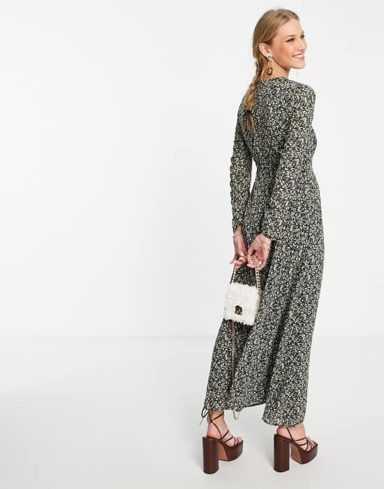 https://images.asos-media.com/products/ghospell-long-sleeve-maxi-dress-with-cut-out-in-dark-winter-floral/201618912-4?$n_550w$&wid=550&fit=constrain