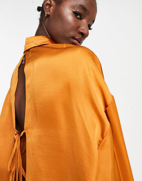 https://images.asos-media.com/products/ghospell-oversized-satin-shirt-with-open-back-in-rust/202381050-4?$n_550w$&wid=550&fit=constrain