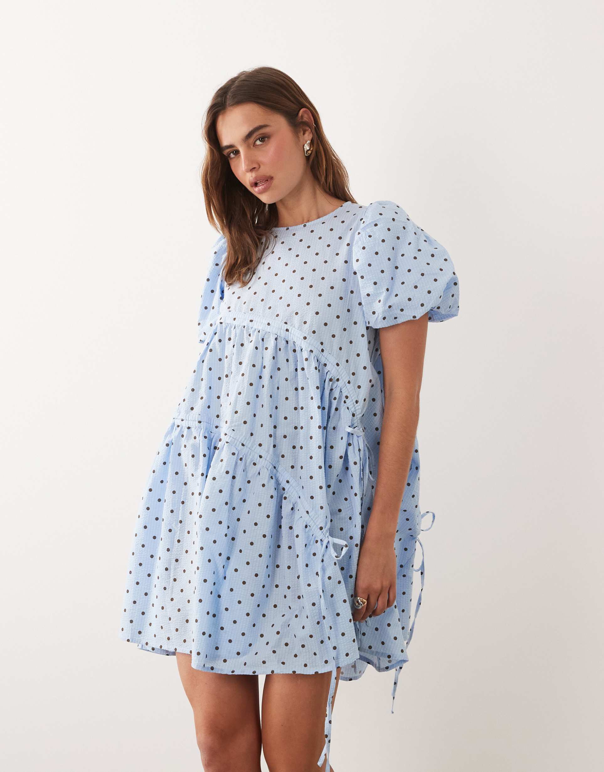 ghospell seersucker puff sleeve asymmetric drawstring detail mini dress in light blue polka dot