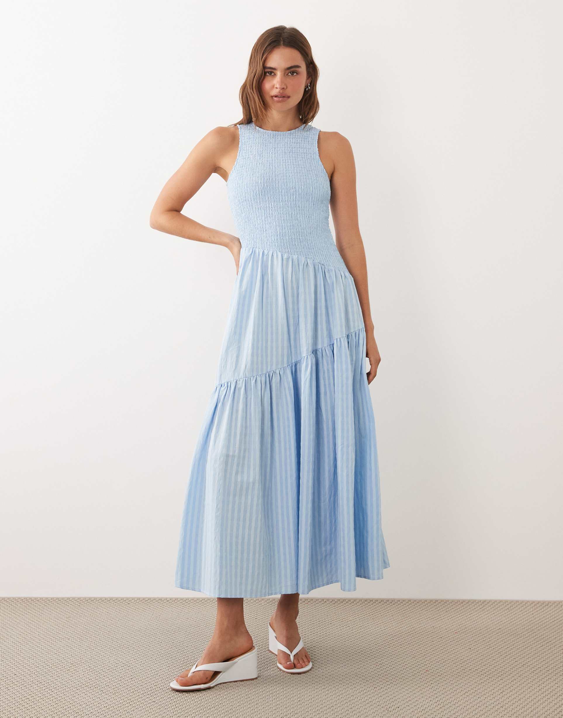ghospell sleeveless shirred bodice asymmetric detail tiered skirt midi dress in light blue pinstripe