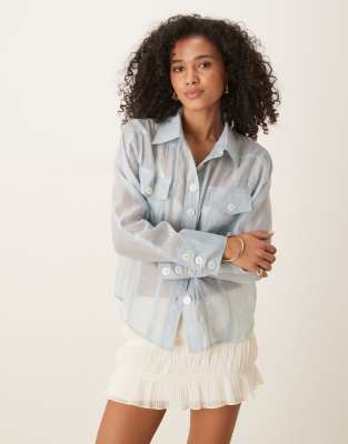 Ghospell - Transparente Organza-Bluse in Blau mit Taschen