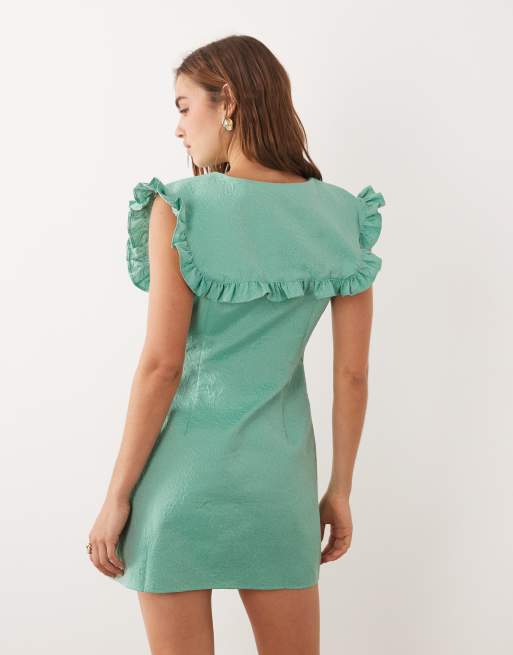 Ghospell - Vestito corto oversize senza maniche verde con volant e colletto, 2 di 4
