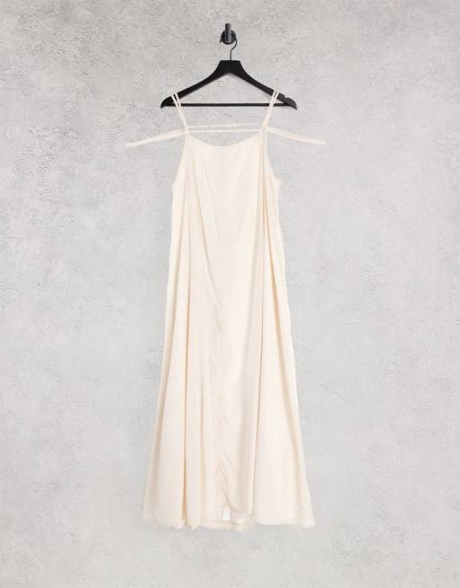 Ghospell - Vestito sottoveste con gonna al polpaccio aperto dietro color crema con laccetti