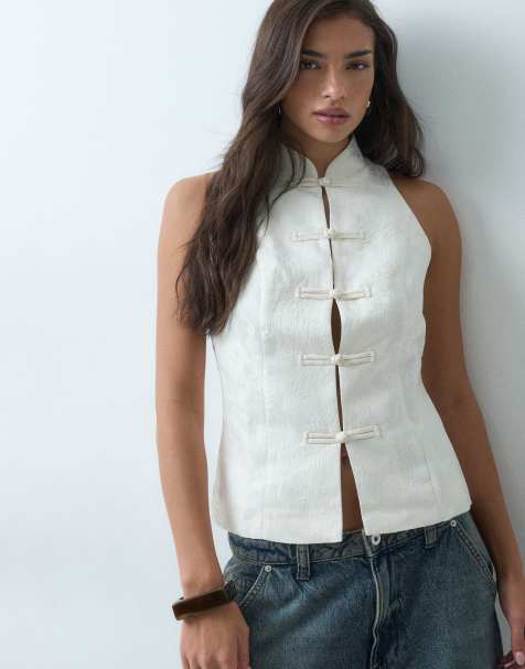 Gina Tricot ärmlös topp med mandarin-krage och knäppning hela vägen i crème med blommigt mönster - view 1