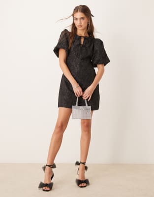 balloon sleeve jacquard mini dress with tie front detail in black