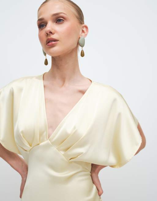 Gina Tricot batwing sleeve plunge neck satin maxi dress in butter yellow |  ASOS