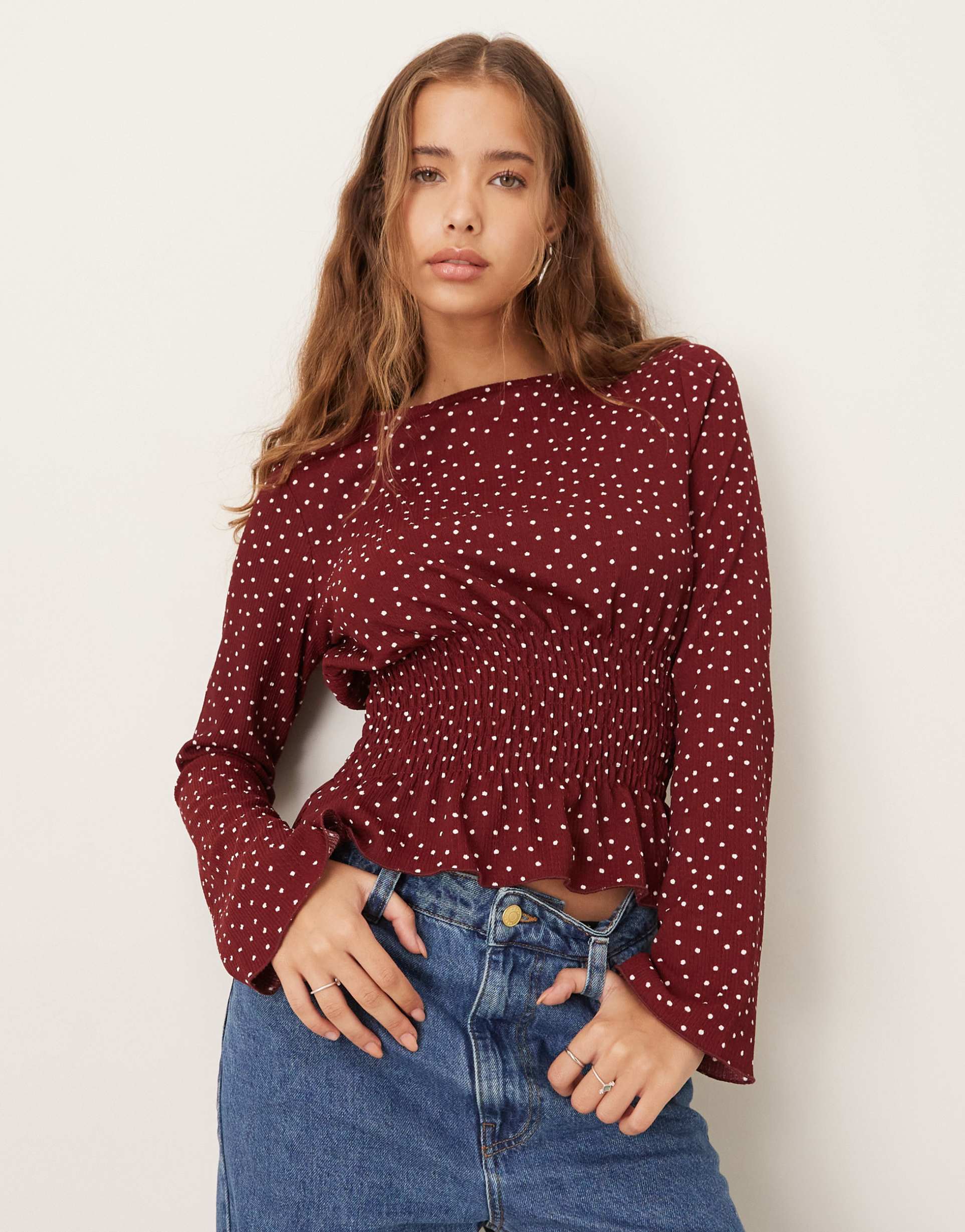gina tricot cinched waist long sleeve top in burgundy polka dot