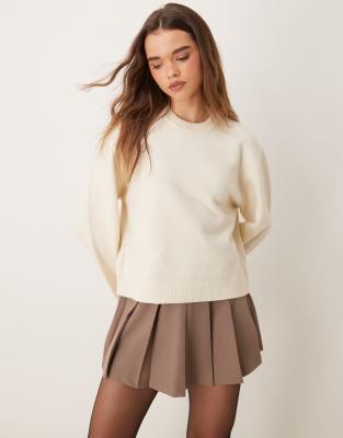 crew neck knitted sweater with wide sleeves in cream-White