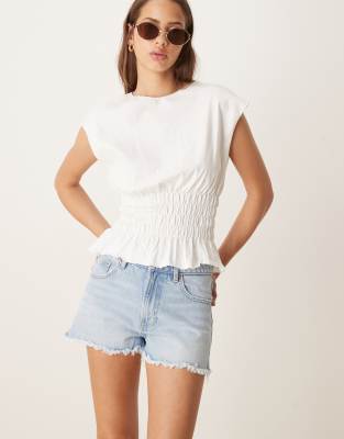 denim shorts with split hems in light wash blue