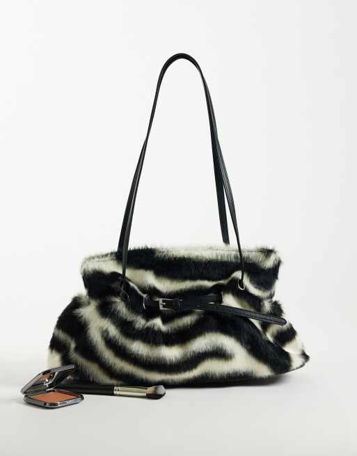 Gina Tricot faux fur shoulder bag with strap and clutch detail in zebra ...