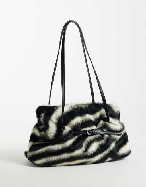 Gina Tricot faux fur shoulder bag with strap and clutch detail in zebra ...