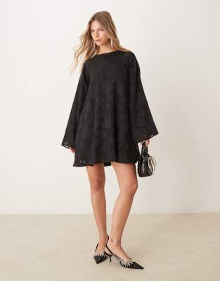 jacquard sheer mini swing dress with satin bow back detail in black