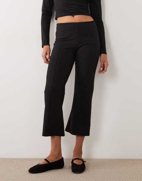 Gina Tricot kick flare trousers in black - view 1