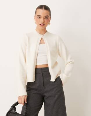 knitted cardigan with one button detail in cream-White